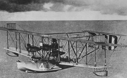 Pioneers-of-transatlantic-flight model soars by Flying Boat Museum Foynes under cloudy skies.