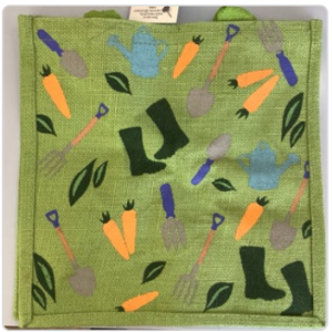 Green hessian bag with scattered carrots, wellies, leaves, and tools.
