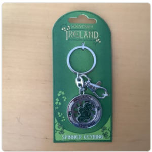 Silver shamrock keyring, green “Souvenir of Ireland” packaging.